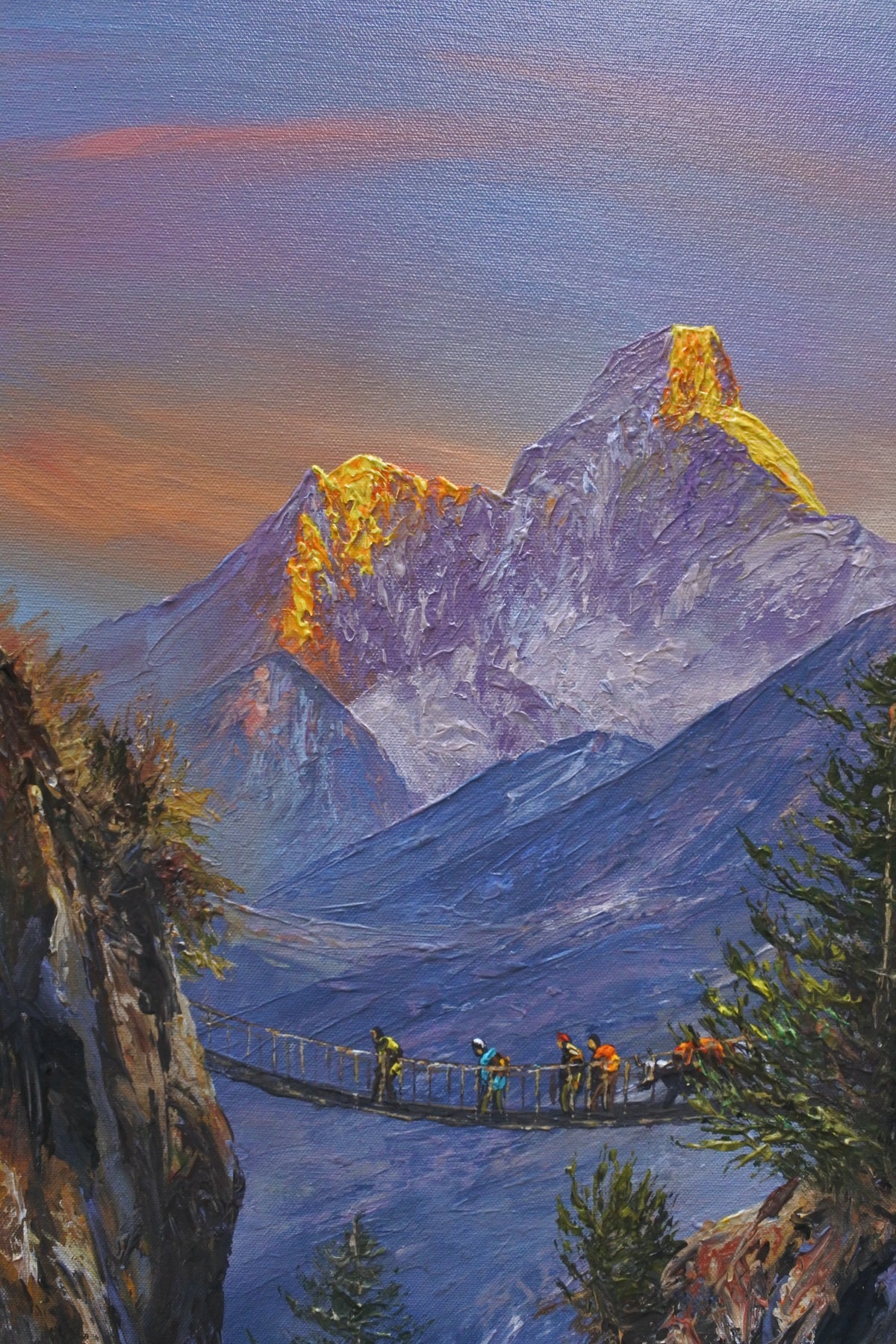 Close-up of the textured brushwork and golden highlights in an original Himalayan mountain painting.