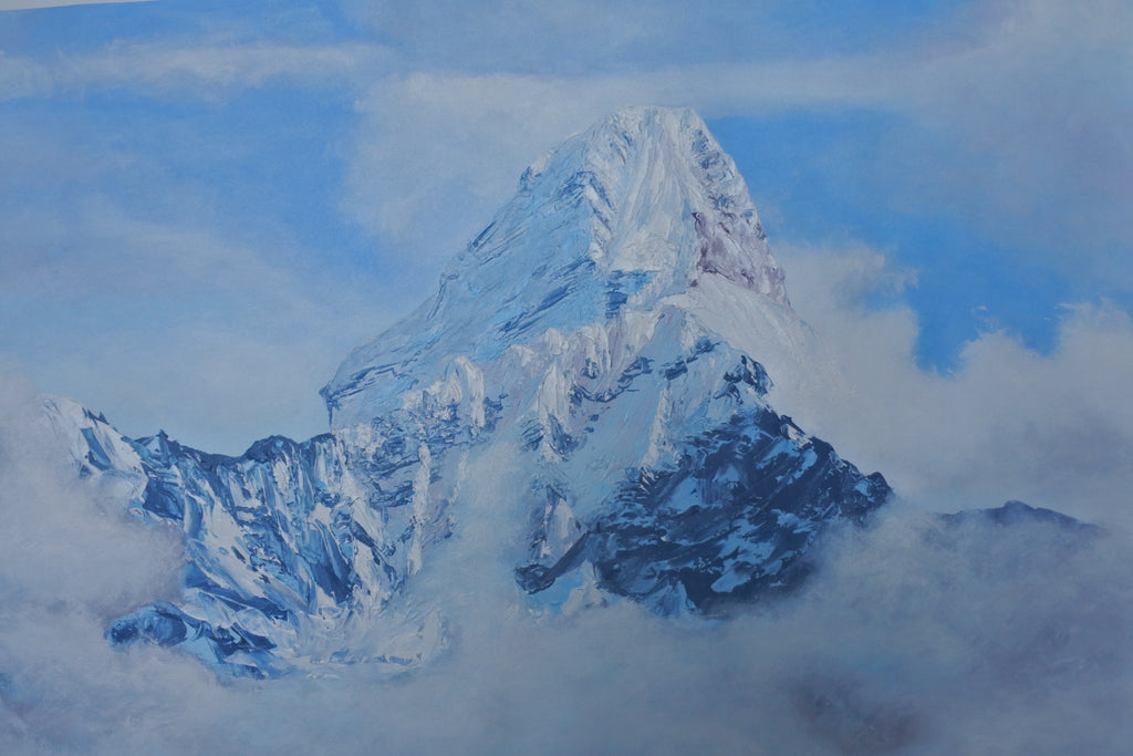 A painted mountain landscape showing a snow-covered peak rising above clouds, with blue sky and white mist surrounding the base.