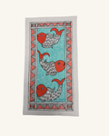A rectangular textile featuring a traditional Mumbly style print with three red and gray fish on a turquoise blue background, framed by a coral and gray geometric border, shown flat against a light cream backdrop.