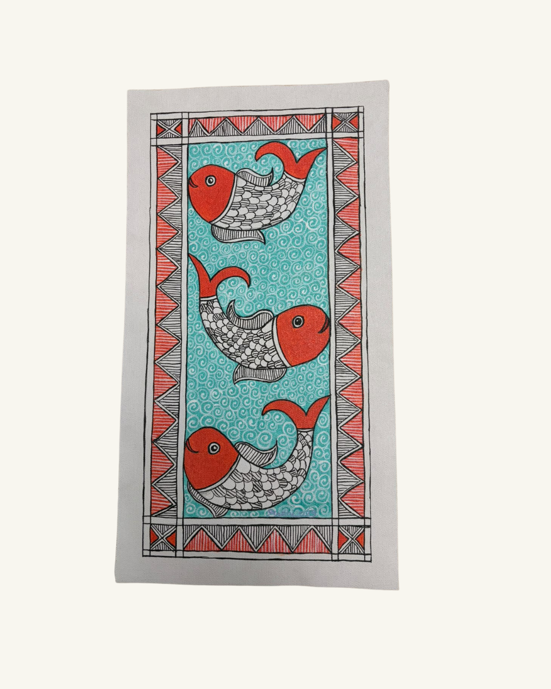 A rectangular textile featuring a traditional Mumbly style print with three red and gray fish on a turquoise blue background, framed by a coral and gray geometric border, shown flat against a light cream backdrop.