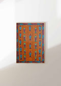 Framed artwork with geometric pattern on an orange background, mounted on a white wall.